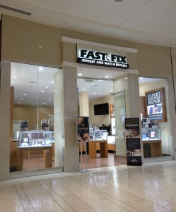 Store front of a Fast-Fix location that shows the front store window display