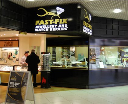 Fast-Fix store front in a mall that shows the front window display