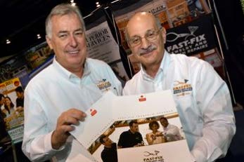 Two smiling men holding Fast-Fix brochures 